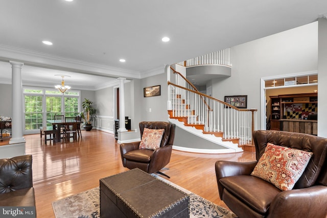 8800 Primula Dr, Laytonsville, MD 20882 - living area with ornate columns, ornamental molding, wood finished floors, stairway, and wainscoting
