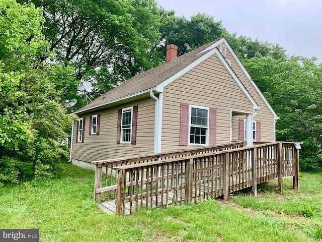 30536 Bennett Rd, Salisbury, MD 21804 - view of front of home featuring a chimney, a wooden deck, and a shingled roof
