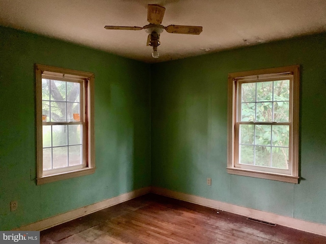 30536 Bennett Rd, Salisbury, MD 21804 - unfurnished room featuring plenty of natural light, wood finished floors, baseboards, and ceiling fan