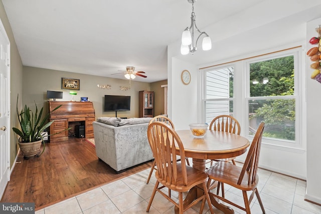 26 Spring Lake Dr, Stafford, VA 22556 - dining room with light tile patterned flooring, healthy amount of natural light, a ceiling fan, and baseboards