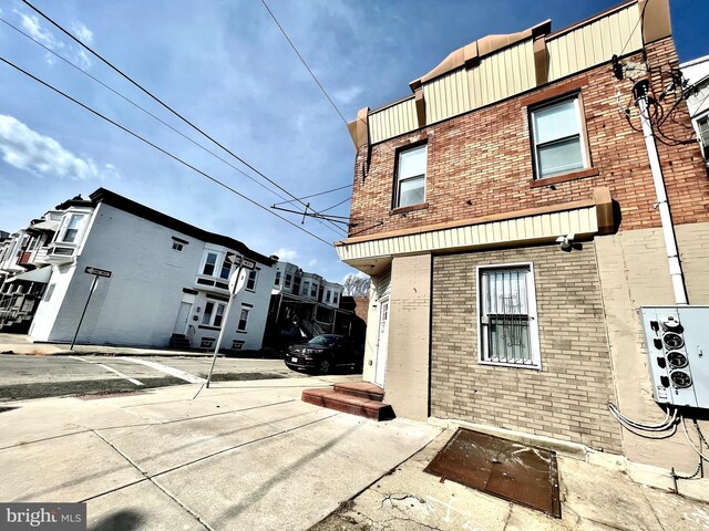 6227 Callowhill St, Philadelphia, PA 19151 - rear view of house with brick siding and a residential view