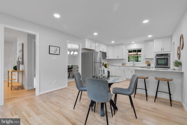1334 Elsinore Ave, Mclean, VA 22102 - dining room featuring light wood-type flooring, baseboards, and recessed lighting