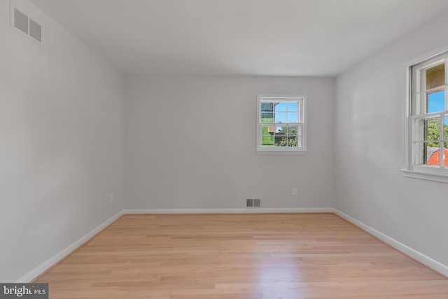 1334 Elsinore Ave, Mclean, VA 22102 - spare room featuring light wood-style flooring, plenty of natural light, and baseboards