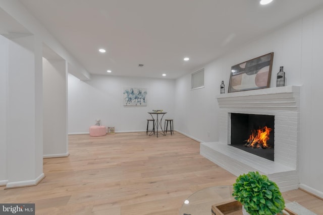 1334 Elsinore Ave, Mclean, VA 22102 - living area with a fireplace, light wood-type flooring, recessed lighting, and baseboards