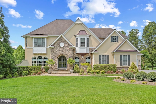 2860 Pfefferkorn Rd, West Friendship, MD 21794 - view of front of home with stucco siding, stone siding, a front yard, a standing seam roof, and metal roof