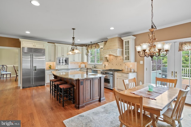 2860 Pfefferkorn Rd, West Friendship, MD 21794 - kitchen with built in appliances, custom range hood, a chandelier, ornamental molding, and an island with sink