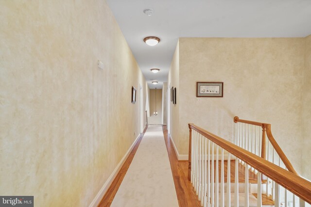 2860 Pfefferkorn Rd, West Friendship, MD 21794 - corridor with wood finished floors, an upstairs landing, and baseboards