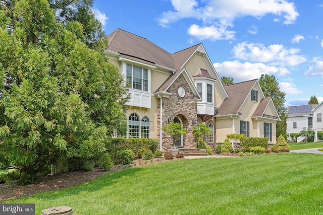 2860 Pfefferkorn Rd, West Friendship, MD 21794 - view of front facade featuring stucco siding, stone siding, and a front yard