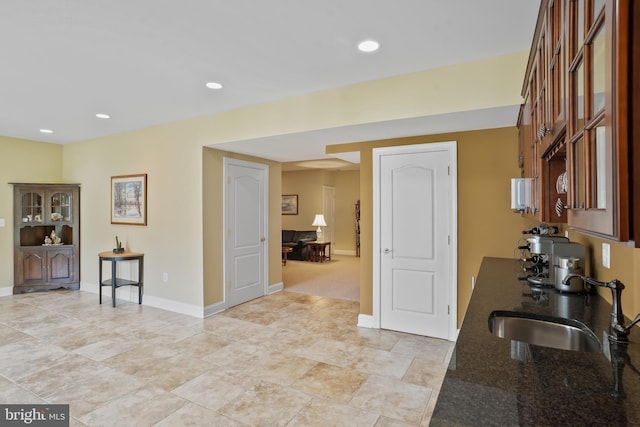 2860 Pfefferkorn Rd, West Friendship, MD 21794 - kitchen with a sink, dark stone countertops, baseboards, and recessed lighting