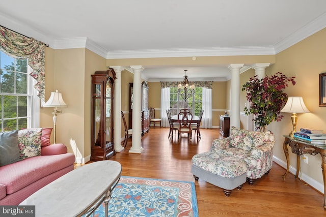 2860 Pfefferkorn Rd, West Friendship, MD 21794 - living area featuring decorative columns, ornamental molding, a chandelier, wood finished floors, and baseboards