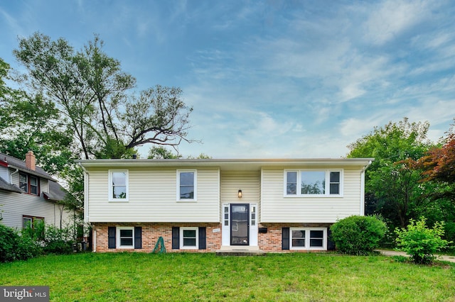 4002 52nd St, Bladensburg, MD 20710 - split foyer home with a front lawn and brick siding