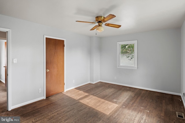 4002 52nd St, Bladensburg, MD 20710 - spare room with a ceiling fan, wood finished floors, and baseboards