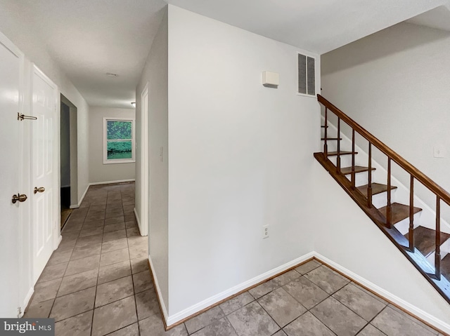 13109 Mica Ct, Silver Spring, MD 20904 - stairway with tile patterned flooring and baseboards
