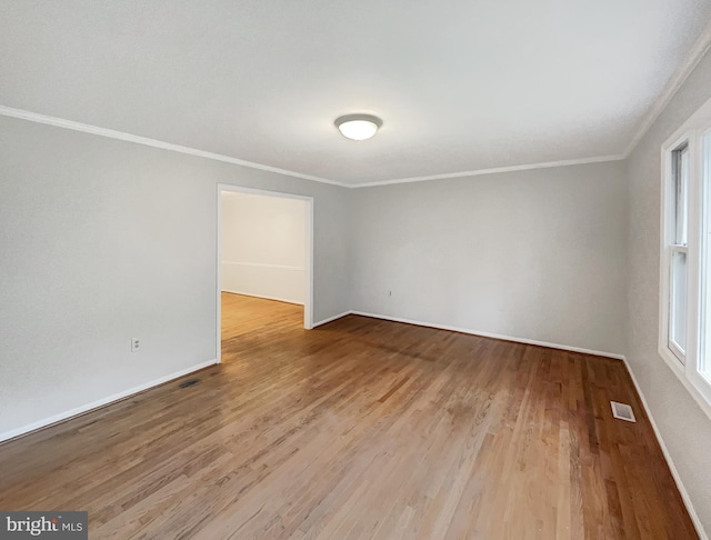 13109 Mica Ct, Silver Spring, MD 20904 - empty room with ornamental molding, wood finished floors, baseboards, and plenty of natural light
