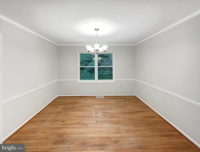 13109 Mica Ct, Silver Spring, MD 20904 - spare room with a chandelier, light wood-style floors, baseboards, and ornamental molding