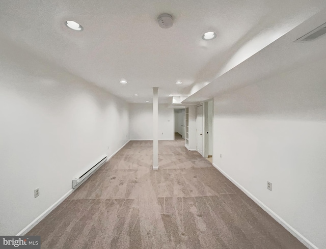 13109 Mica Ct, Silver Spring, MD 20904 - finished basement featuring a baseboard radiator, recessed lighting, carpet, and baseboards