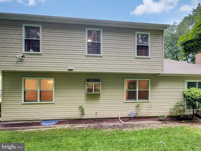 13109 Mica Ct, Silver Spring, MD 20904 - rear view of house featuring a lawn and a chimney