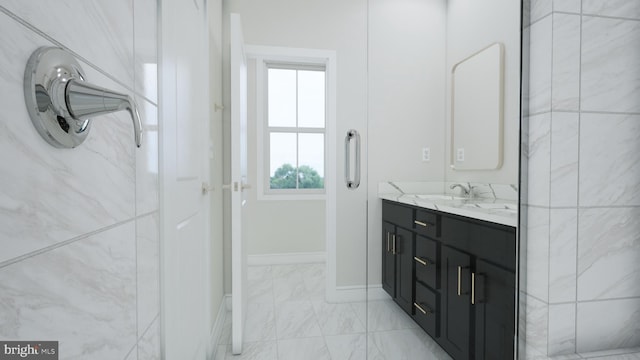 42096 Picasso Sq, Ashburn, VA 20148 - bathroom with vanity, marble finish flooring, and baseboards
