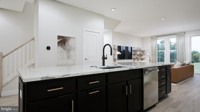 42096 Picasso Sq, Ashburn, VA 20148 - kitchen featuring a sink, dark cabinets, open floor plan, light wood-type flooring, and stainless steel dishwasher
