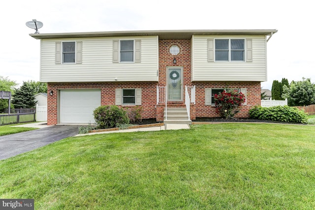 1667 Beech Ln, Hanover, PA 17331 - split foyer home featuring brick siding, driveway, and an attached garage