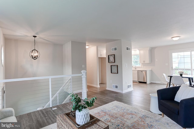 1667 Beech Ln, Hanover, PA 17331 - living area with a chandelier, wood finished floors, and baseboards
