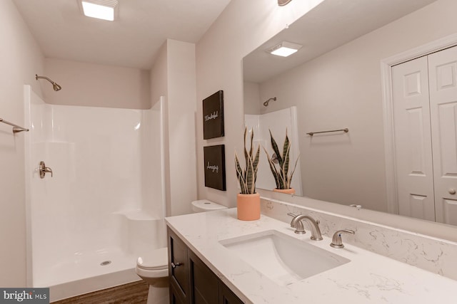1667 Beech Ln, Hanover, PA 17331 - bathroom featuring toilet, a shower, vanity, and wood finished floors