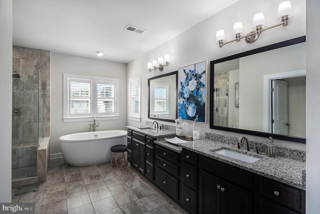 15 Ruthies Way, Chalfont, PA 18914 - bathroom with a shower stall, double vanity, a freestanding tub, marble finish flooring, and a chandelier