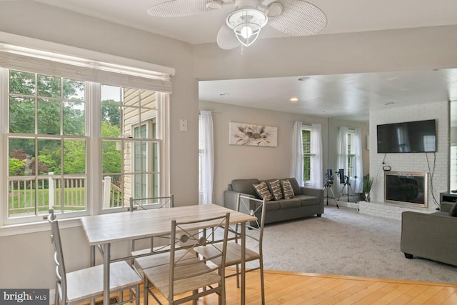 9710 Magledt Rd, Baltimore, MD 21234 - dining space featuring healthy amount of natural light, a ceiling fan, a brick fireplace, and recessed lighting