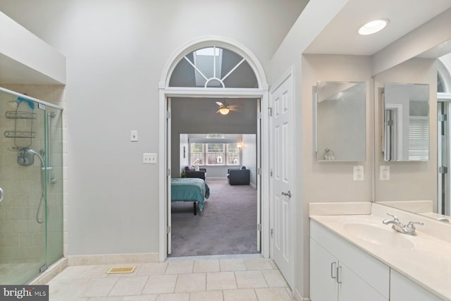 9710 Magledt Rd, Baltimore, MD 21234 - bathroom featuring vanity, a shower stall, a ceiling fan, tile patterned flooring, and ensuite bathroom
