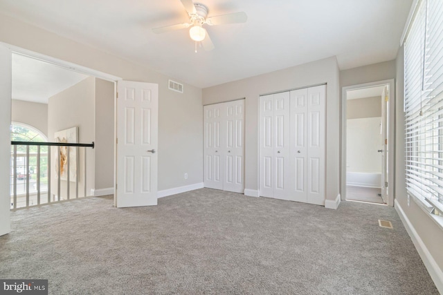 9710 Magledt Rd, Baltimore, MD 21234 - unfurnished bedroom with multiple closets, carpet, and a ceiling fan