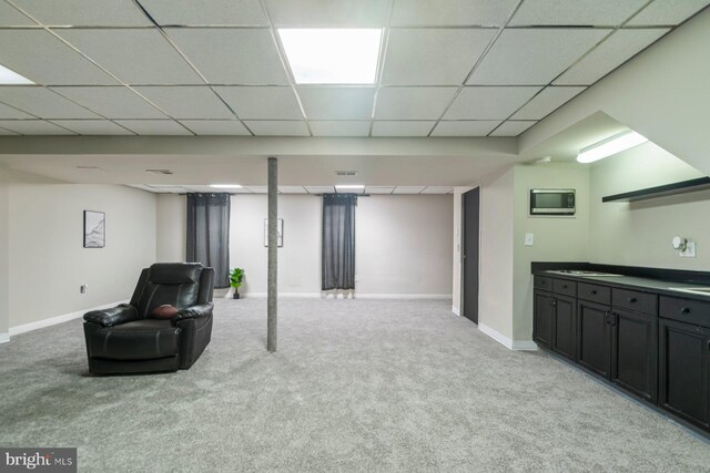 9710 Magledt Rd, Baltimore, MD 21234 - finished below grade area with light colored carpet and a paneled ceiling