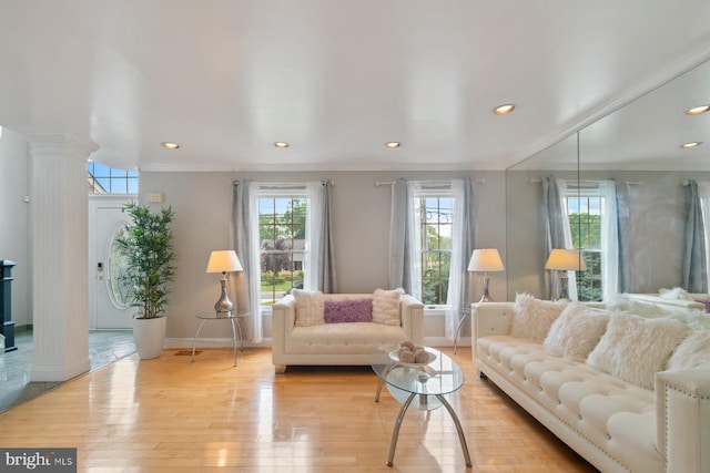 9710 Magledt Rd, Baltimore, MD 21234 - living room with decorative columns, light wood-style flooring, recessed lighting, and crown molding