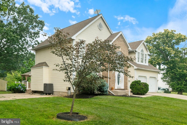 9710 Magledt Rd, Baltimore, MD 21234 - view of front of property featuring concrete driveway, a front yard, an attached garage, and roof with shingles