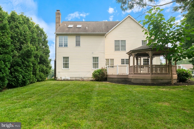 9710 Magledt Rd, Baltimore, MD 21234 - rear view of property featuring a gazebo, a chimney, a wooden deck, a lawn, and roof with shingles