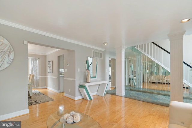 9710 Magledt Rd, Baltimore, MD 21234 - unfurnished living room with stairway, wood finished floors, decorative columns, ornamental molding, and recessed lighting
