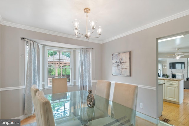 9710 Magledt Rd, Baltimore, MD 21234 - dining room featuring a chandelier, crown molding, and light wood-style flooring