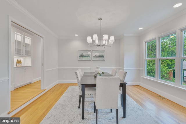 5001 14th St N, Arlington, VA 22205 - dining space featuring light wood-style flooring, crown molding, a chandelier, baseboards, and recessed lighting