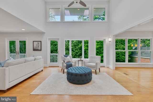 5001 14th St N, Arlington, VA 22205 - living area featuring a high ceiling, ceiling fan, baseboards, and wood finished floors