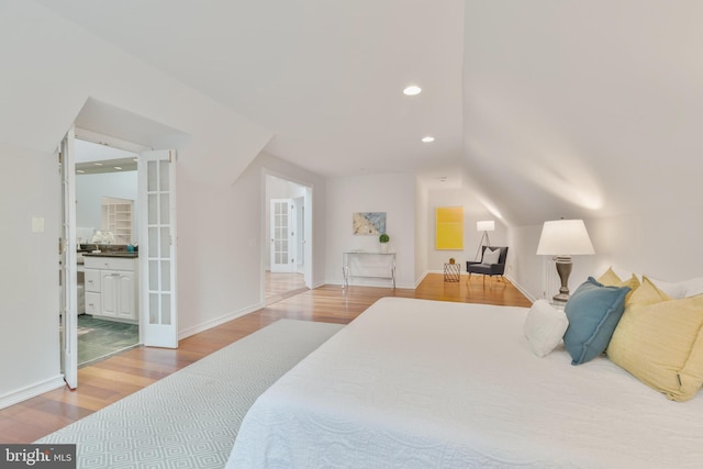 5001 14th St N, Arlington, VA 22205 - bedroom featuring wood finished floors, french doors, lofted ceiling, recessed lighting, and baseboards