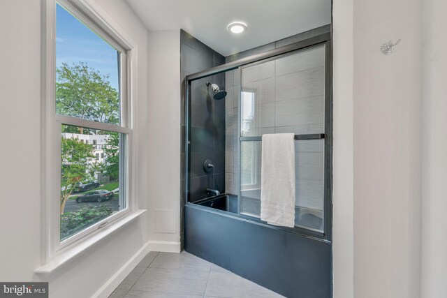 5001 14th St N, Arlington, VA 22205 - bathroom with enclosed tub / shower combo, plenty of natural light, tile patterned floors, and baseboards