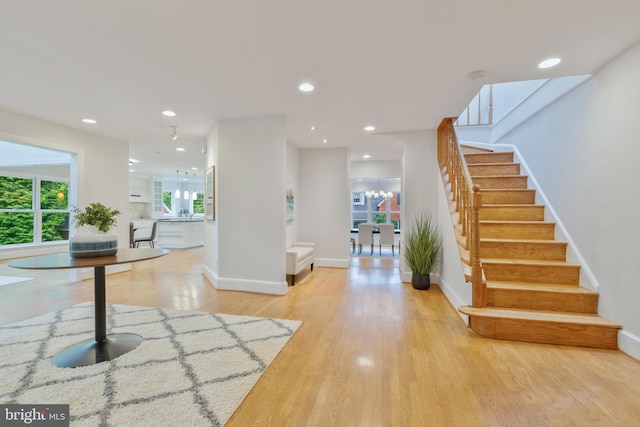 5001 14th St N, Arlington, VA 22205 - foyer entrance with light wood-style flooring, stairs, a chandelier, baseboards, and recessed lighting