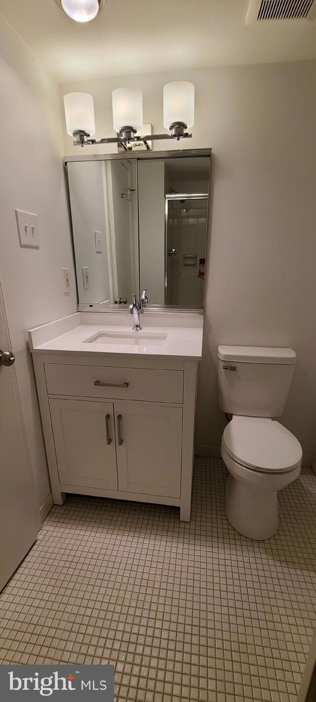 178 Woodstream Building 5, Norristown, PA 19403 - full bathroom with vanity, toilet, a shower with shower door, and tile patterned flooring