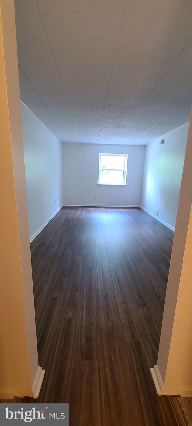 178 Woodstream Building 5, Norristown, PA 19403 - unfurnished room with dark wood-type flooring and baseboards
