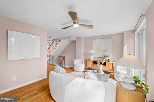 320 G St SW, Washington, DC 20024 - living room with a ceiling fan, wood finished floors, baseboards, and stairs
