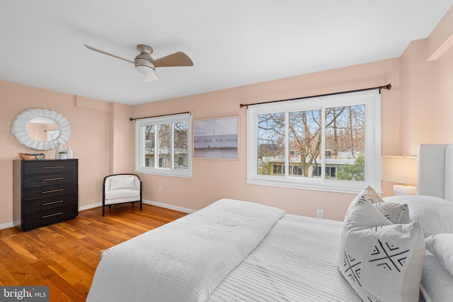 320 G St SW, Washington, DC 20024 - bedroom with wood finished floors, baseboards, and ceiling fan