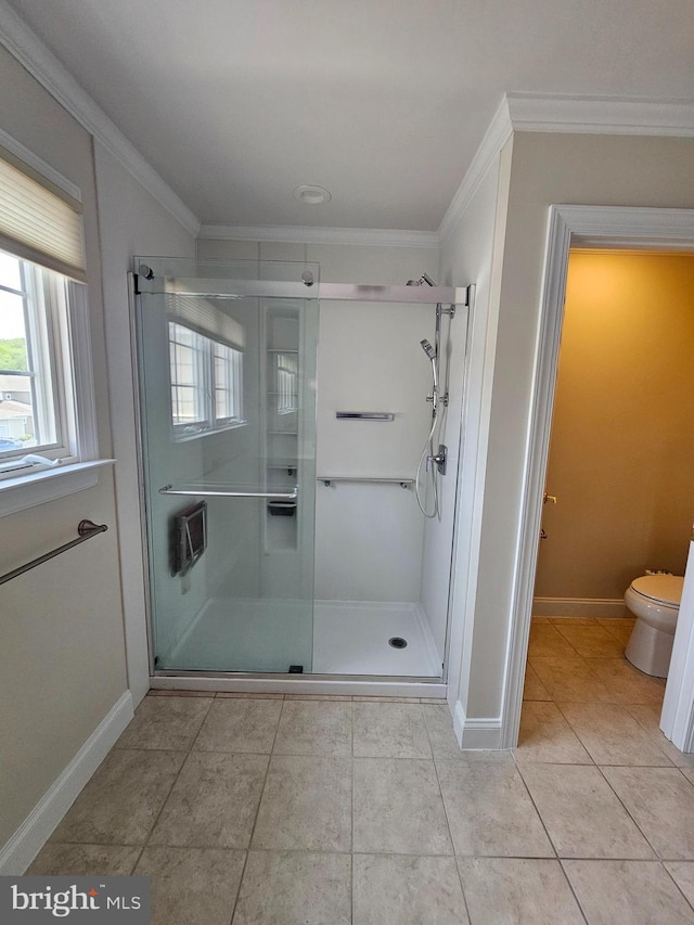 204 Turtle Cv Unit 116, Laurel, DE 19956 - bathroom with crown molding, toilet, a shower stall, baseboards, and tile patterned floors