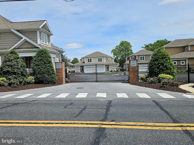 204 Turtle Cv Unit 116, Laurel, DE 19956 - view of asphalt road with a residential view and a gate