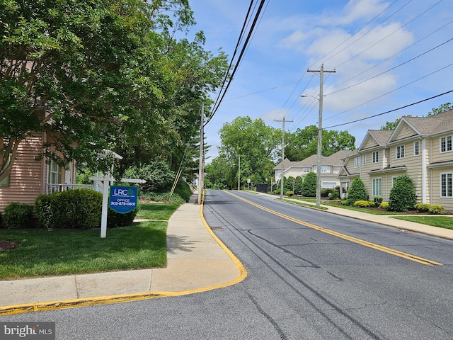 204 Turtle Cv Unit 116, Laurel, DE 19956 - view of asphalt road featuring sidewalks, street lights, curbs, and a residential view