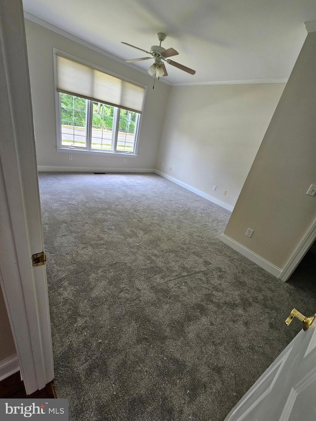 204 Turtle Cv Unit 116, Laurel, DE 19956 - empty room featuring carpet flooring, crown molding, ceiling fan, and baseboards