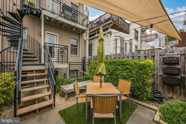 1508 R St NW Unit 2, Washington, DC 20009 - view of patio with stairway, a balcony, and outdoor dining area